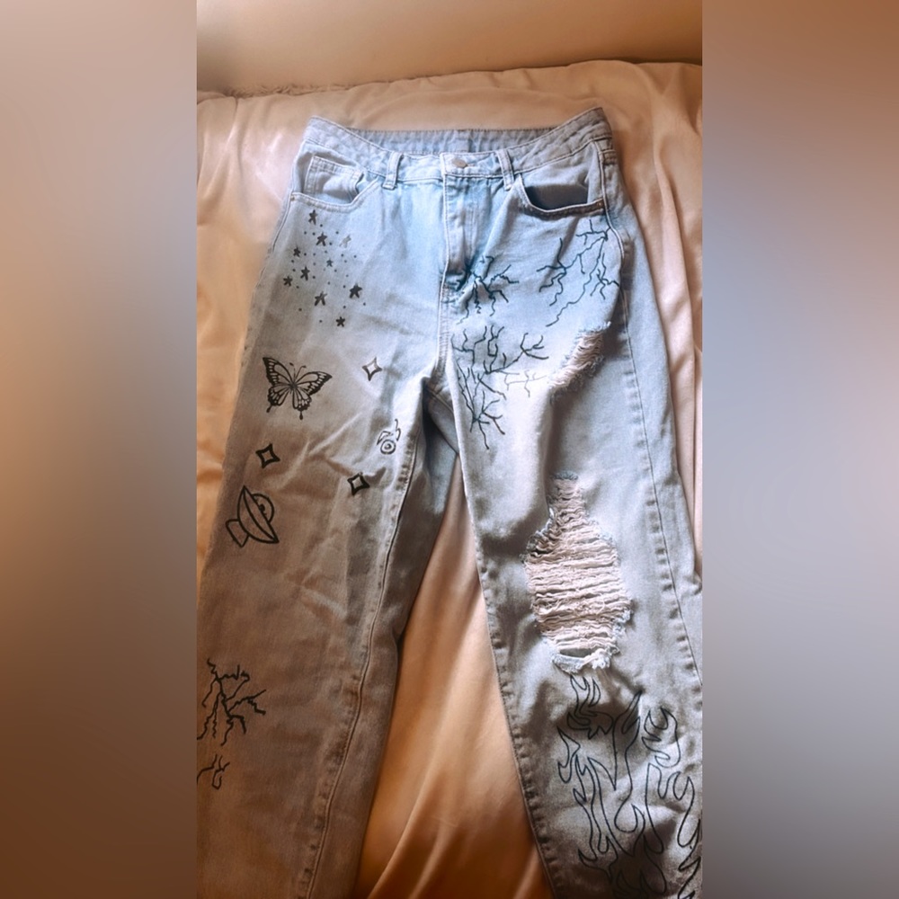 SHEIN graphic designed jeans size small lightly worn :)